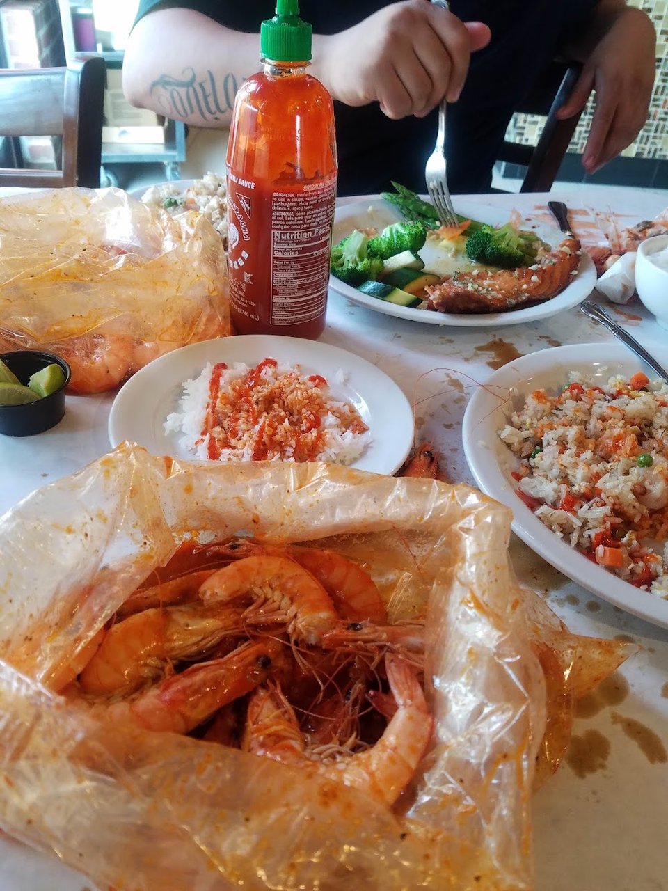 Drinks and sides listed beside seafood dishes.